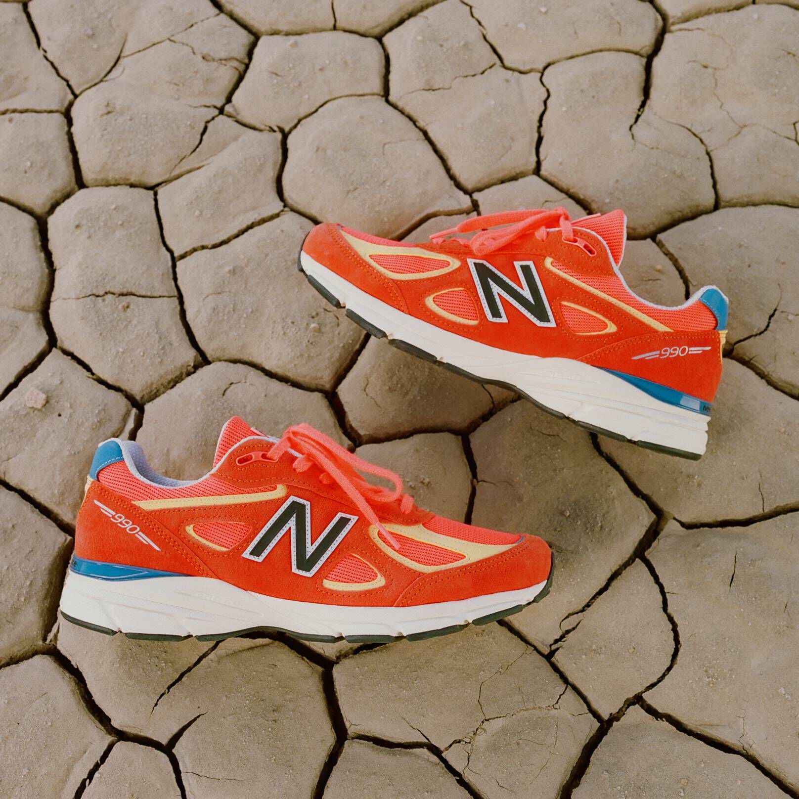 A pair of New Balance sneakers in the desert.