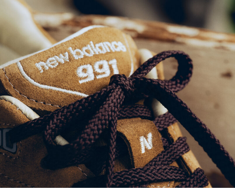 Close up view of a New Balance Made in UK sneaker tongue and laces.  