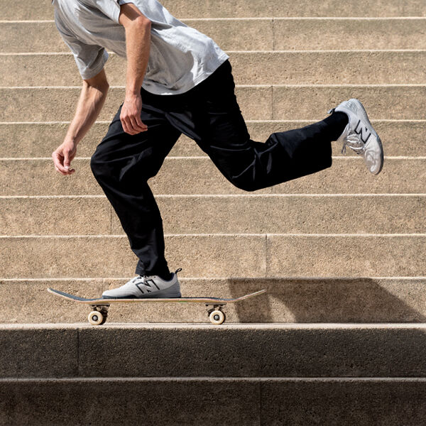 A person skating on the step of a stairs